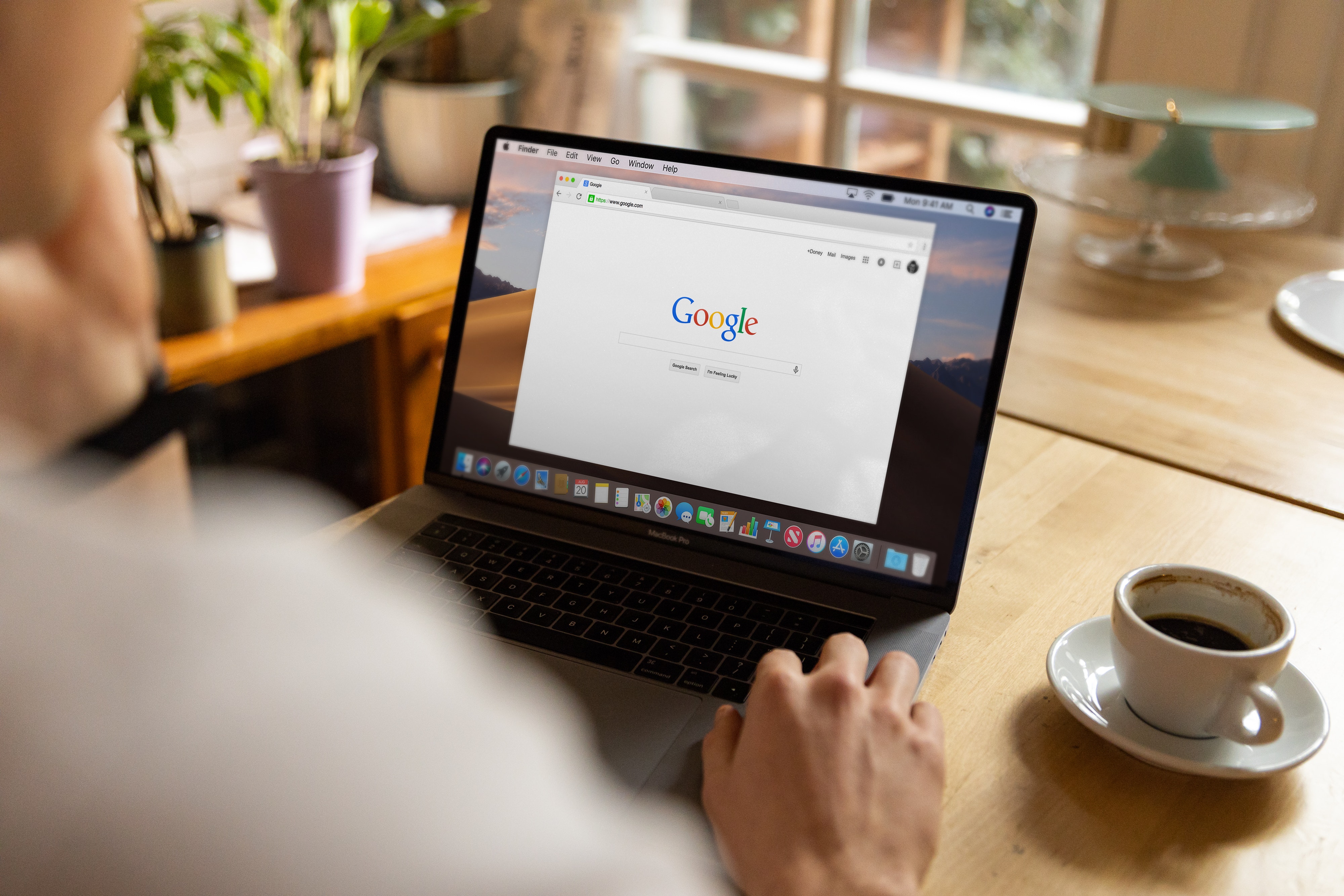 entrepreneur on laptop using google